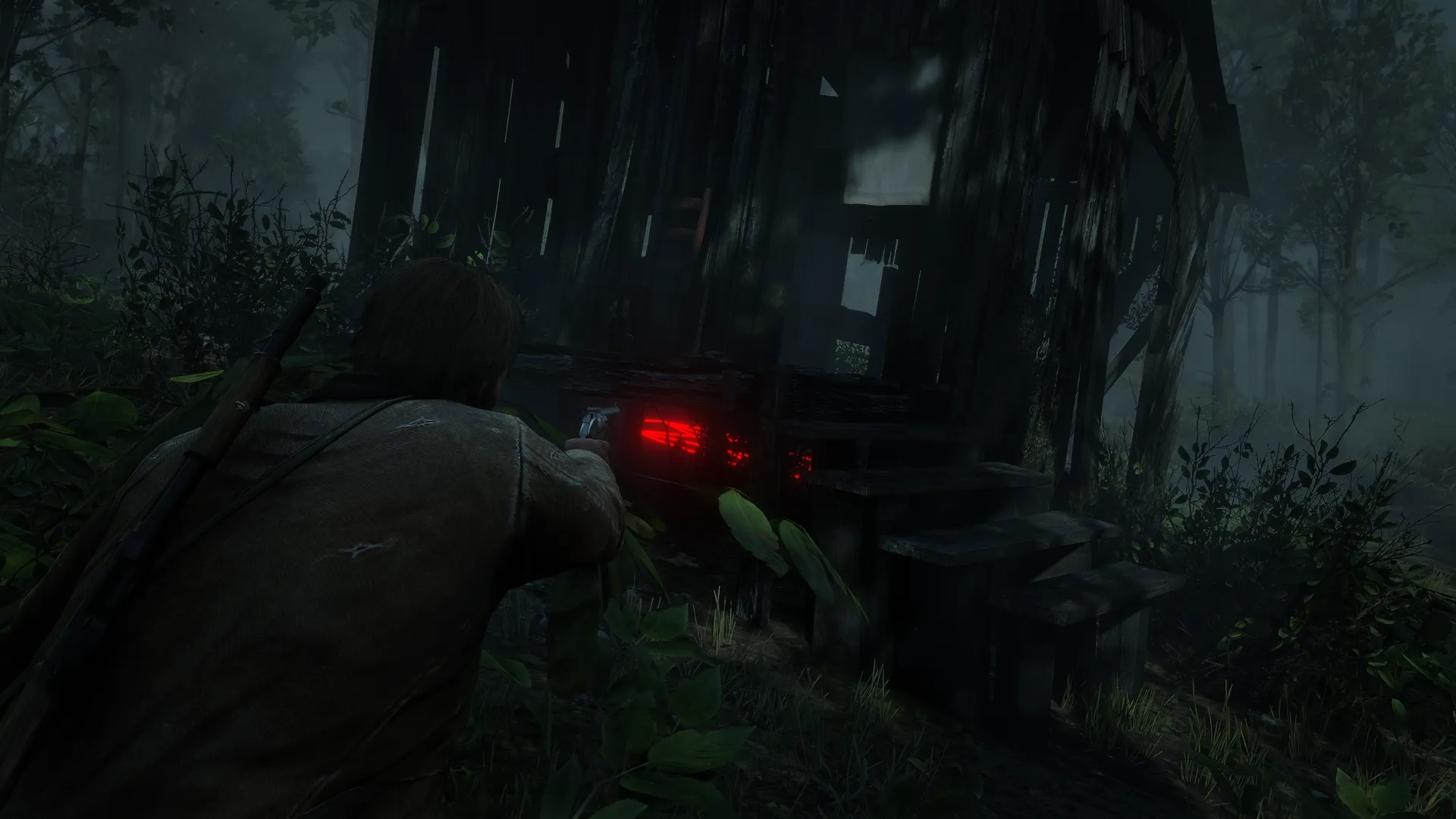 Arthur aims at the Butcher's Creek house in fog, a red glow showing under its porch.